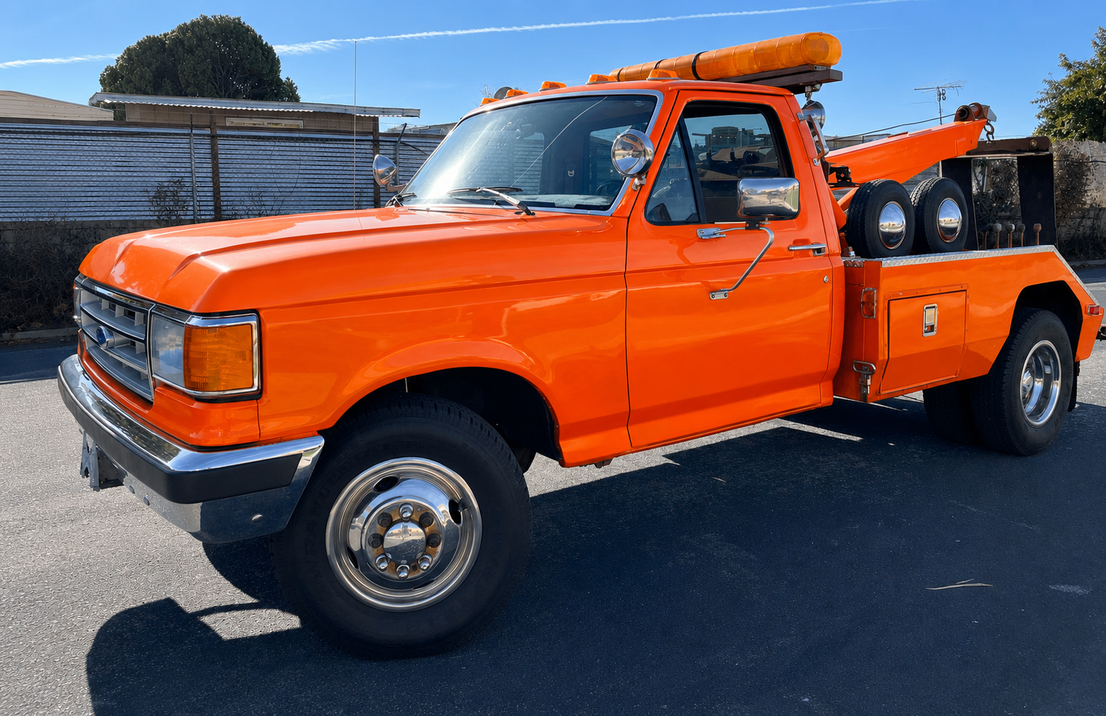 Bright orange tow truck ready for vehicle pickup